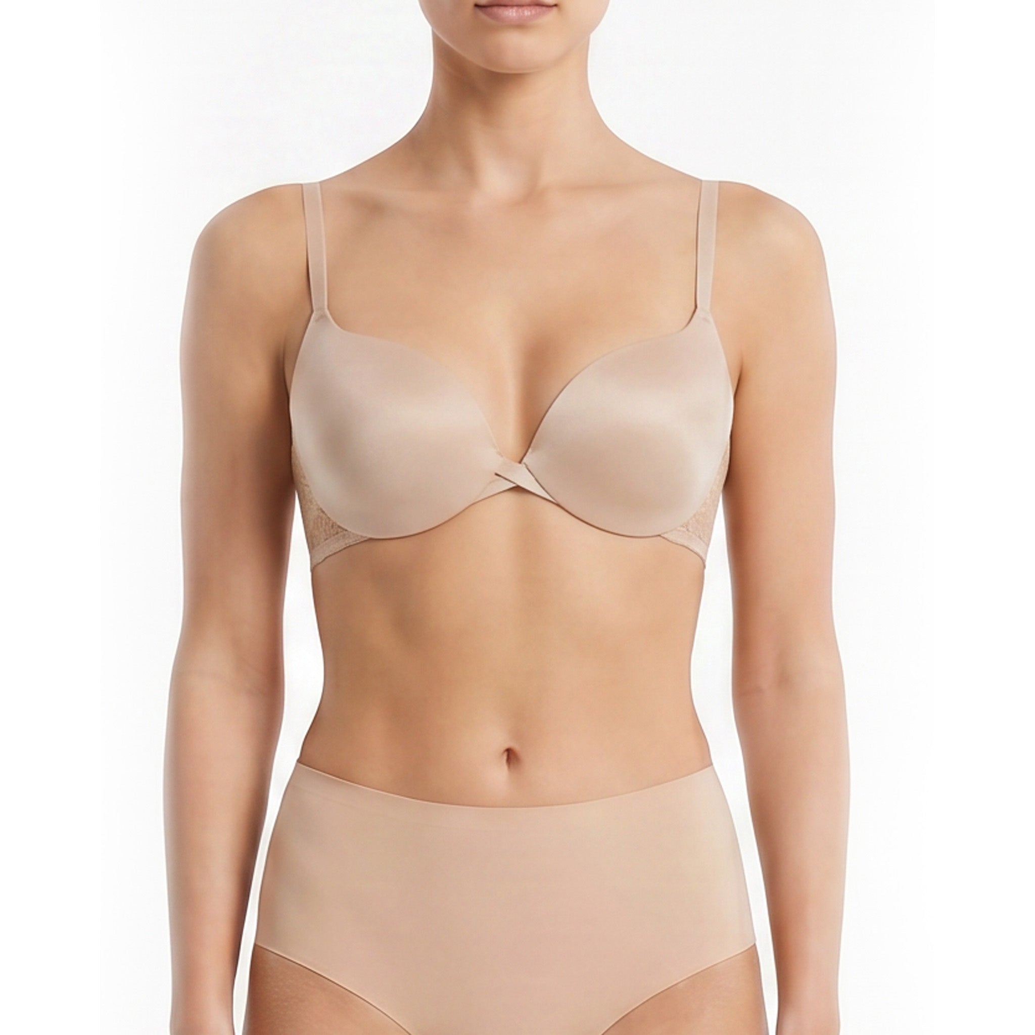 A model wearing a nude-beige underwire bra and matching high-waisted briefs against a plain white background.